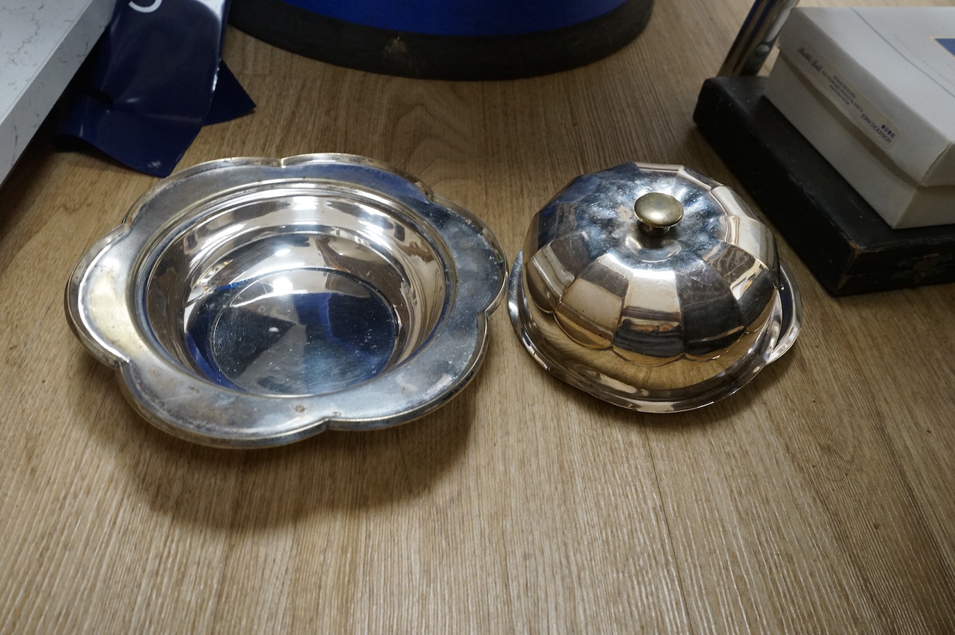 A group of assorted plated wares including an Old Sheffield plated tankard, tea kettle, teapot, flatware etc.